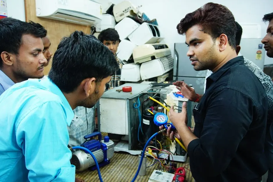 PeakLine technician repairing a kitchen appliance in a San Diego home